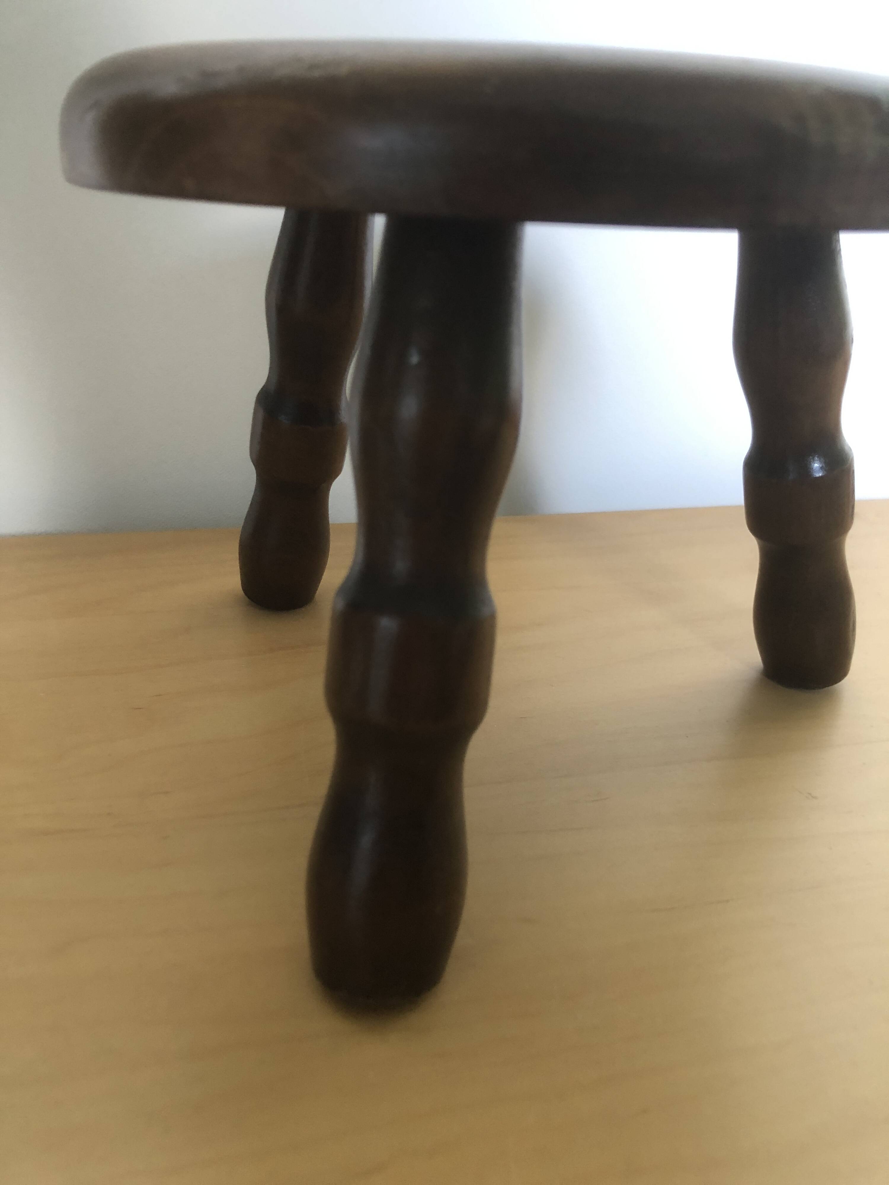Low tripod stool in solid wood