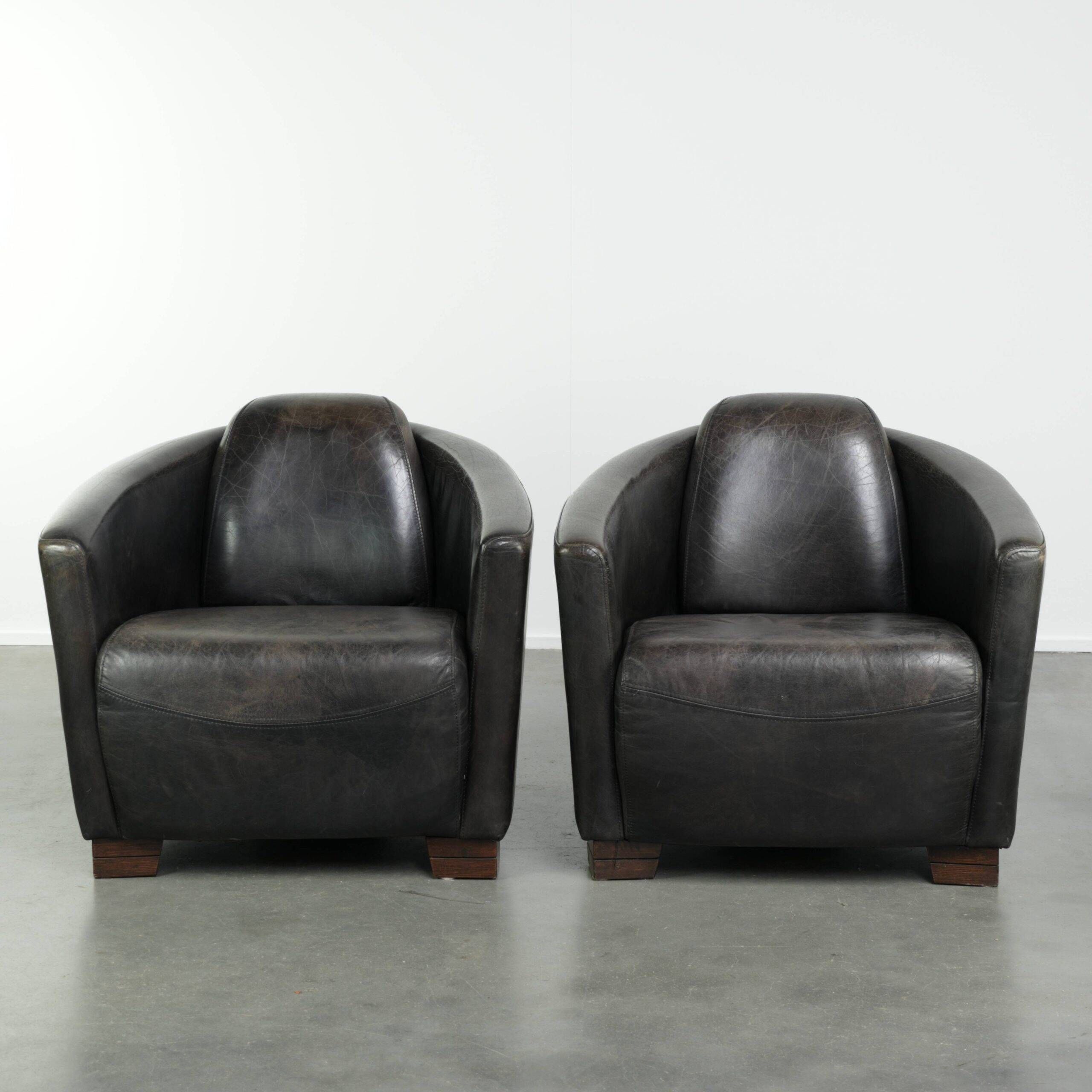Ensemble vintage de 2 fauteuils en cuir de vachette au design Aviateur.