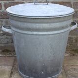 Old galvanized zinc trash can with lid