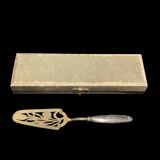 Gold metal pie server