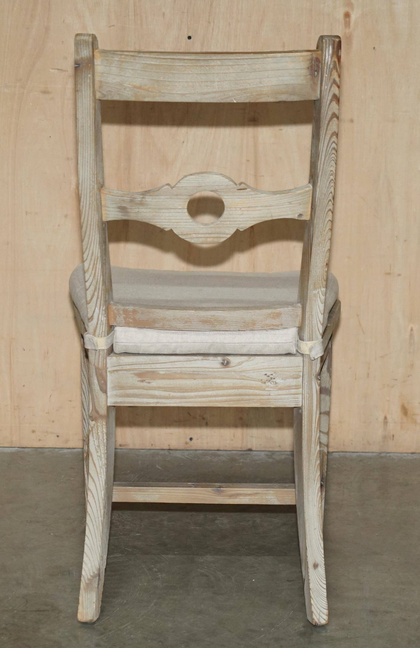 Pair of Swedish-style accent chairs in recycled pine with upholstered seats.
