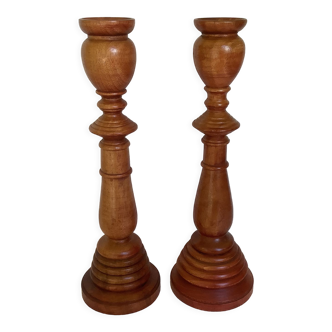 Pair of stained wood candlesticks
