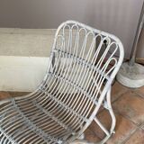 Vintage arched rattan armchair. 1970s.