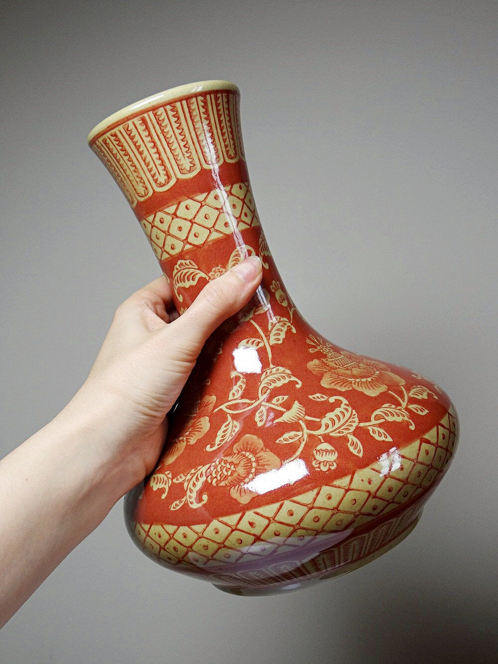 20th century Chinese vase, hand-painted ceramic in an unusual red hue.