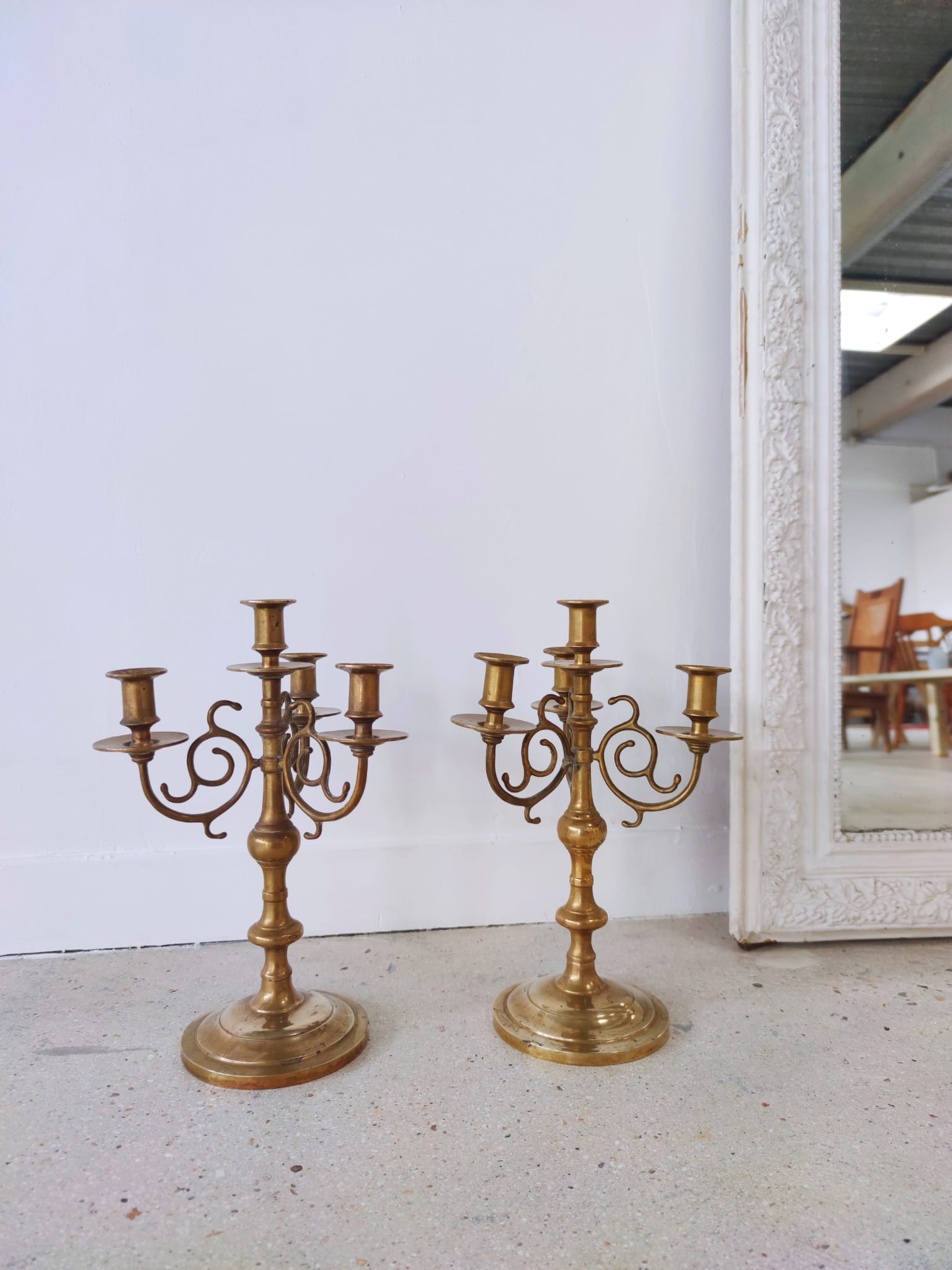 Pair of four-light candle holders in gilded brass