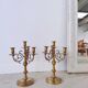 Pair of four-light candle holders in gilded brass