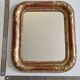 Miroir Louis-Philippe en bois et stuc doré à décor floral, XIXe,  43x38 cm