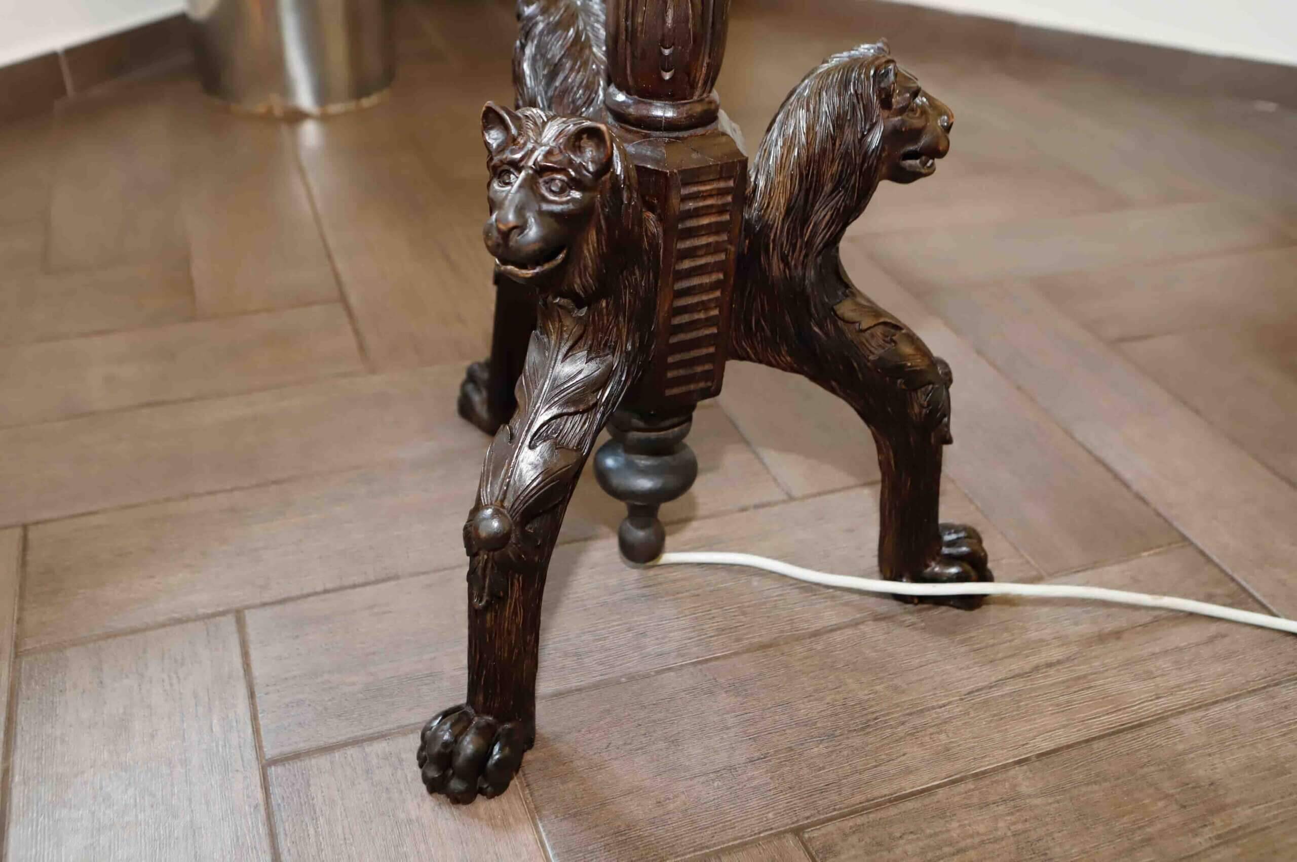 Antique floor lamp with lion motif