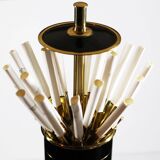 Vintage standing ashtray with cigarette dispenser in gold and black