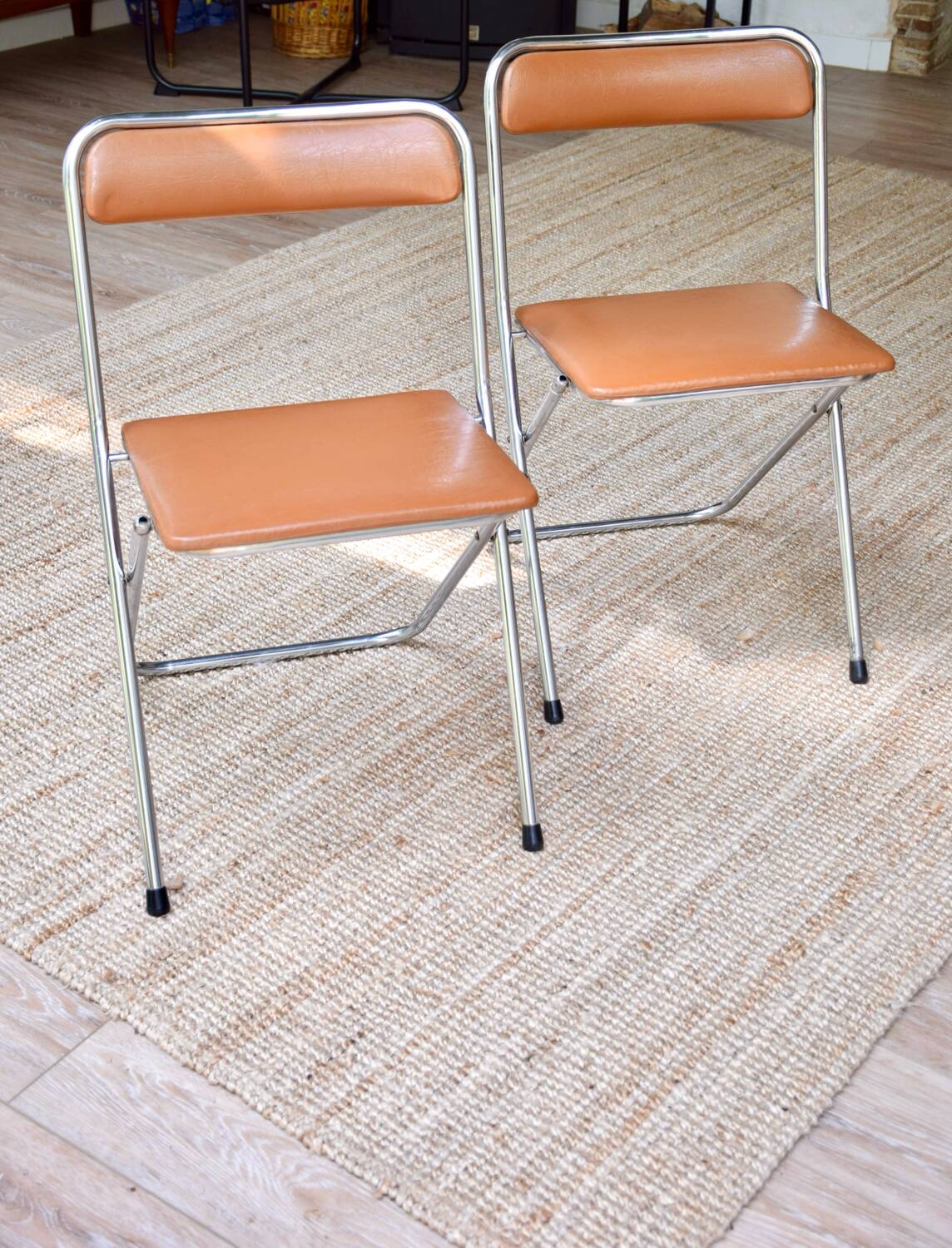 Pair of “Soudexvinyl” folding chairs in skai and chrome tube