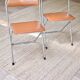 Pair of “Soudexvinyl” folding chairs in skai and chrome tube