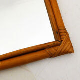 Rounded wall mirror in rattan 35x45cm