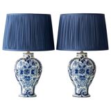 Pair of Royal Delft blue and white ceramic table lamps, 1905, with new pleated silk shades.