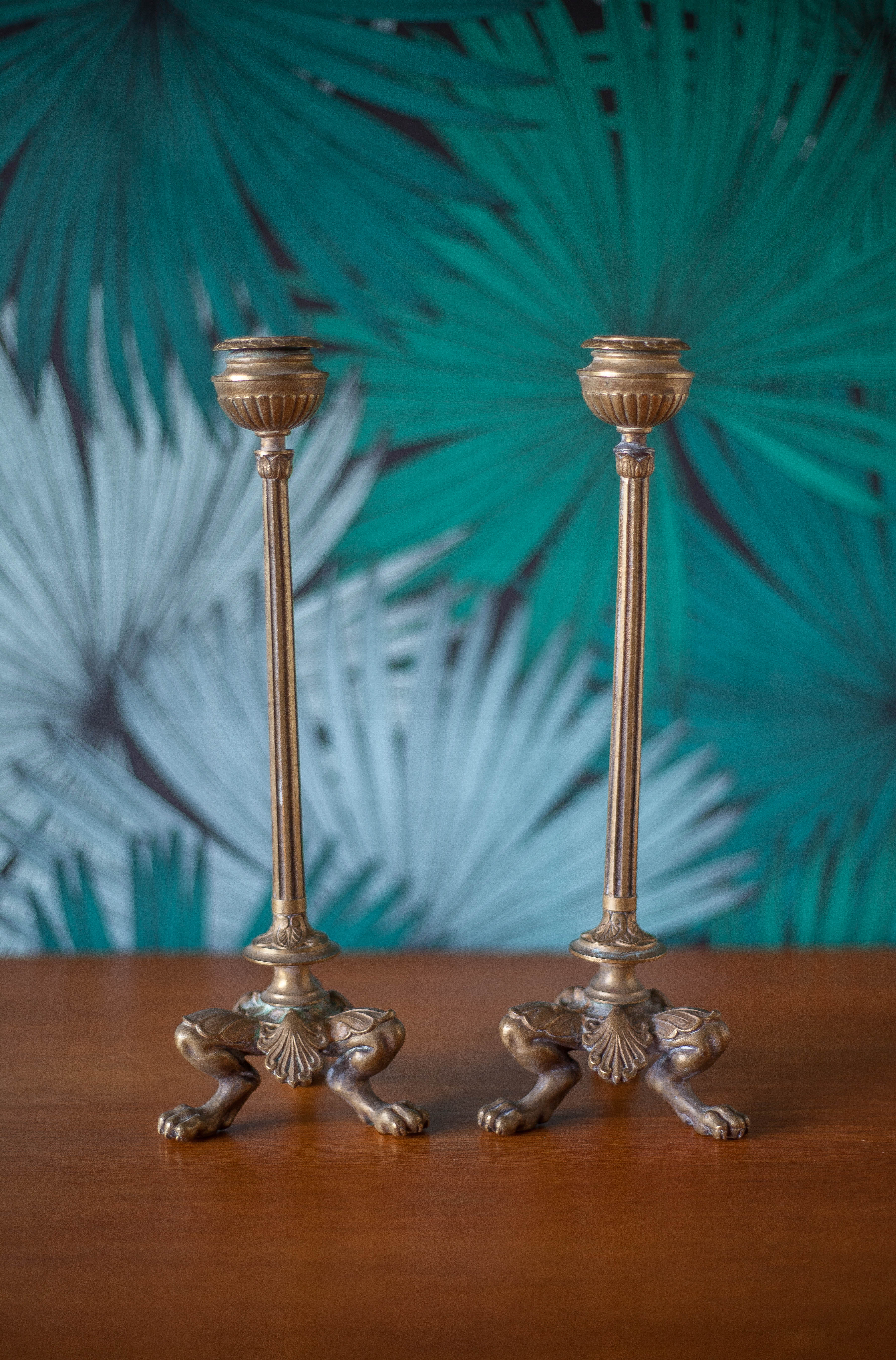 pair of numbered bronze candle holder