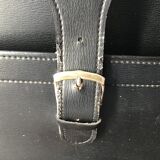 Black soft suitcase with buckle on top