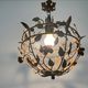 Patinated metal ceiling light with a floral and leaf pattern, 1950s, Italy.