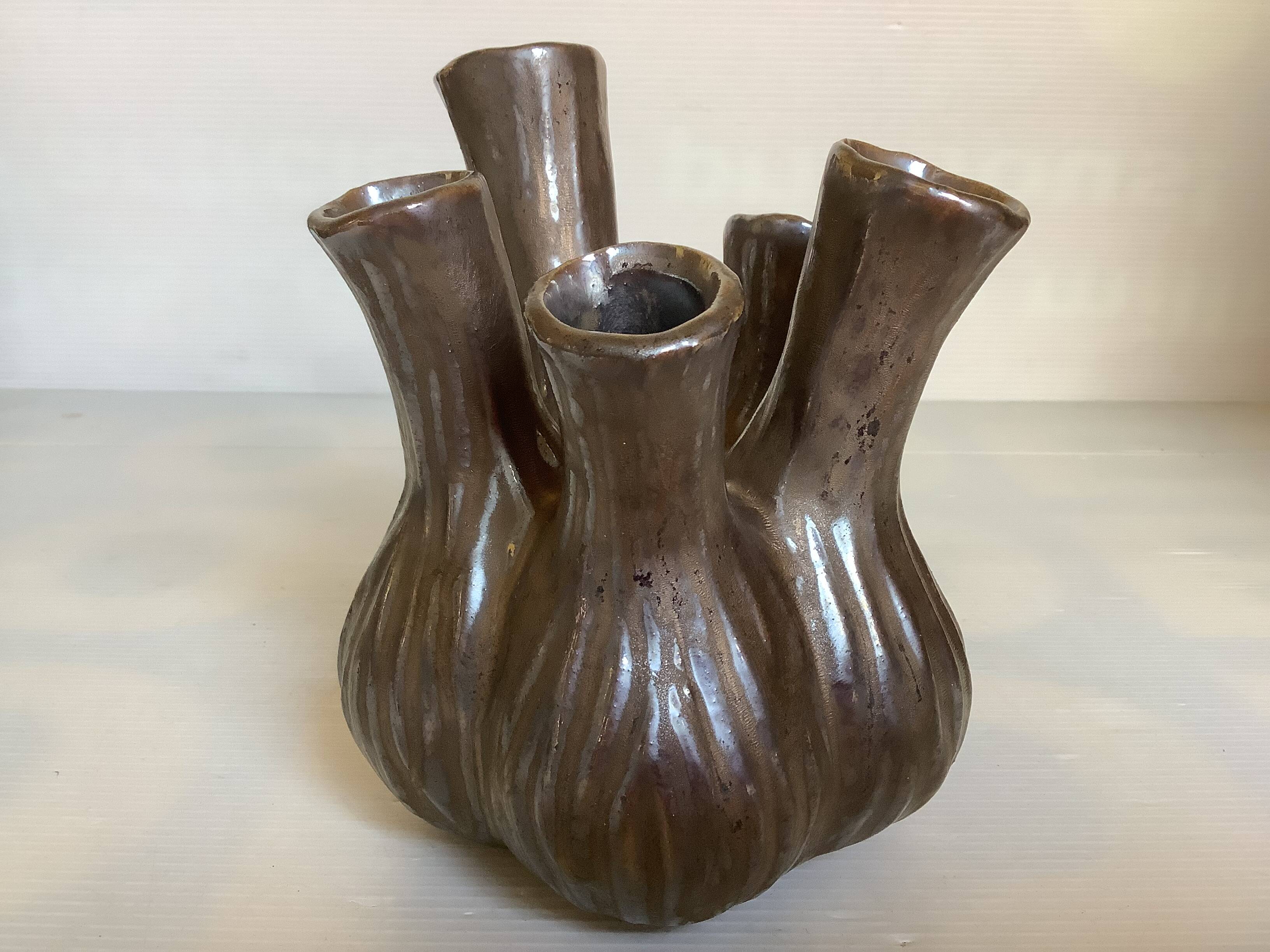 Tulip vase with ceramic flowers in brown and gold.