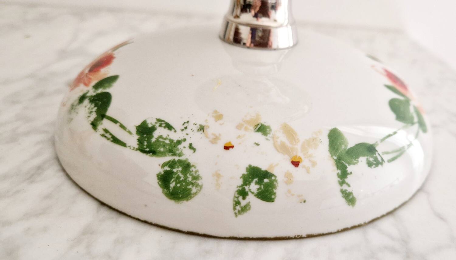 Porcelain cup on silver metal foot