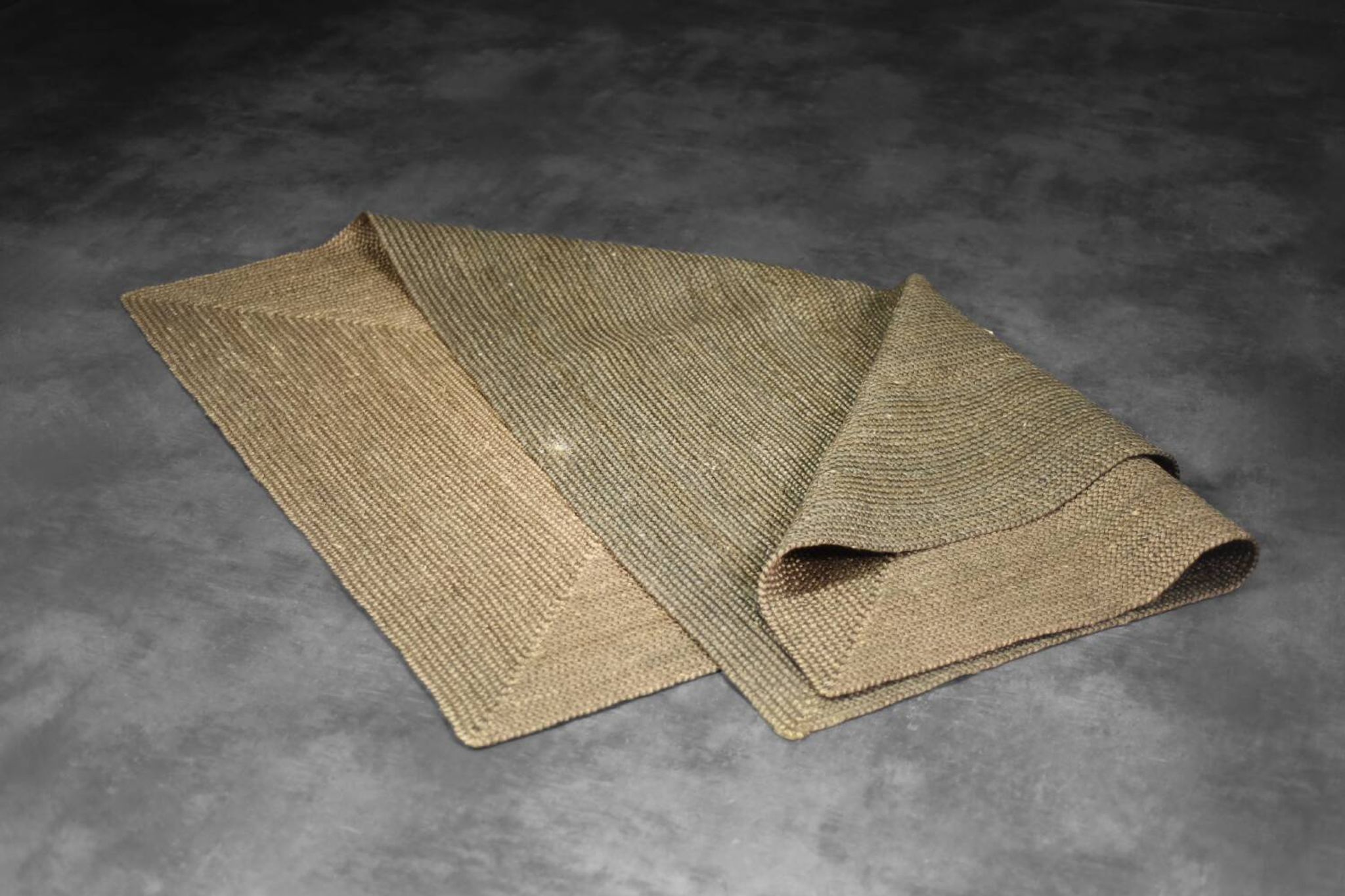Brown flat-woven jute Indian rug, 1970.