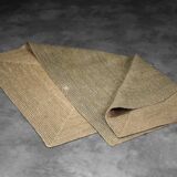 Brown flat-woven jute Indian rug, 1970.