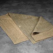 Brown flat-woven jute Indian rug, 1970.