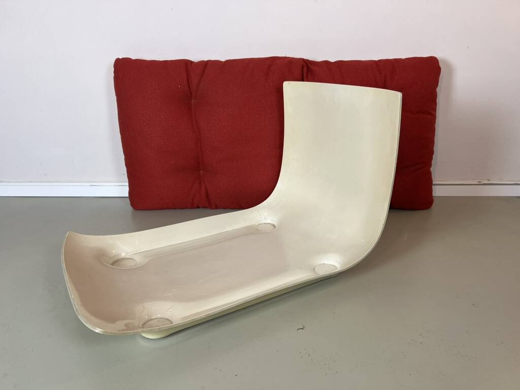 Vintage red shell lounge chairs from the 70s mid-century retro.