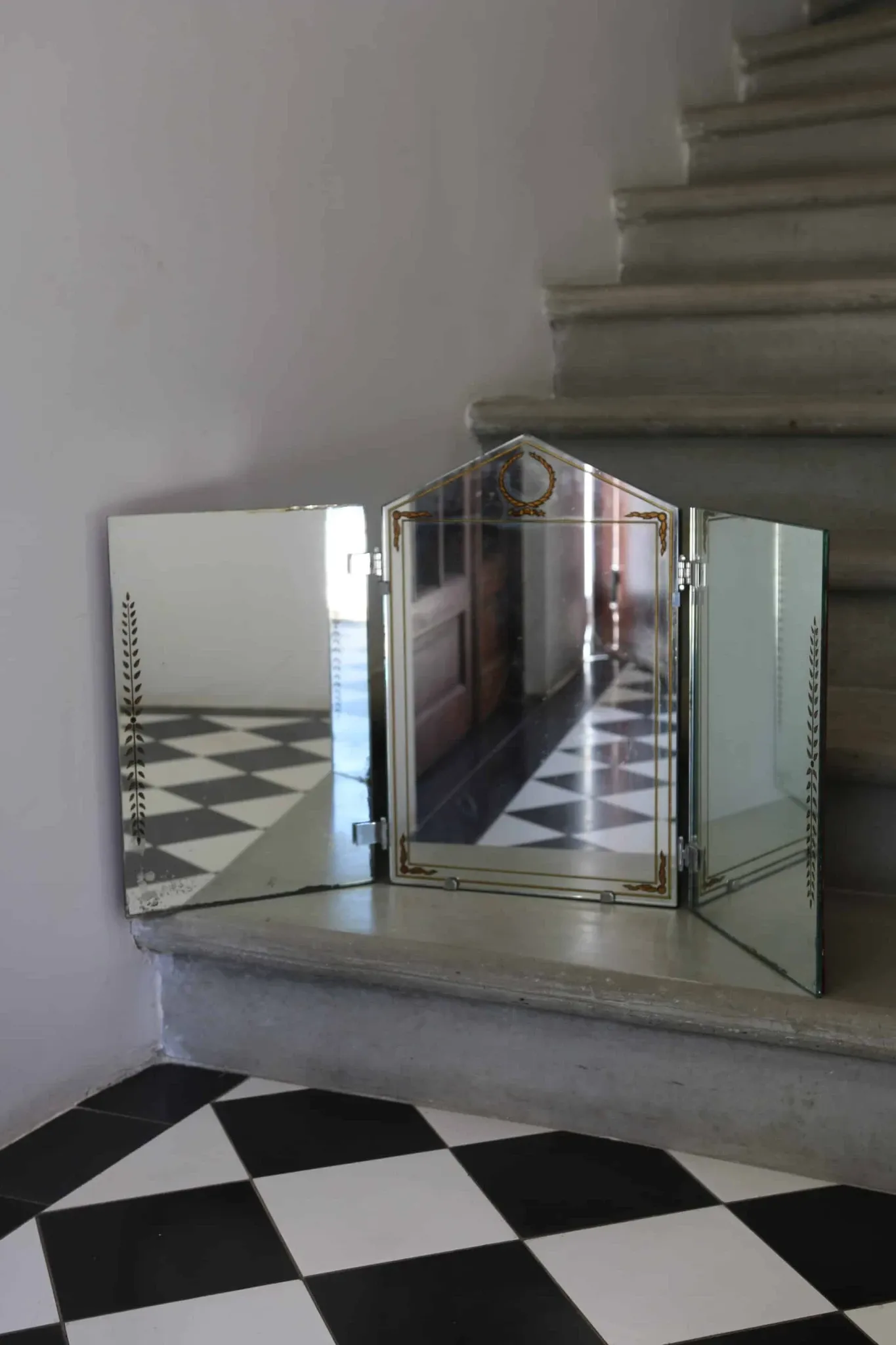 Triptych mirror with eglomisé and pediment, 1940s-50s