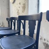 Set of 7 black bistro chairs