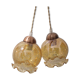 2 iridescent amber luminaires in suspensions