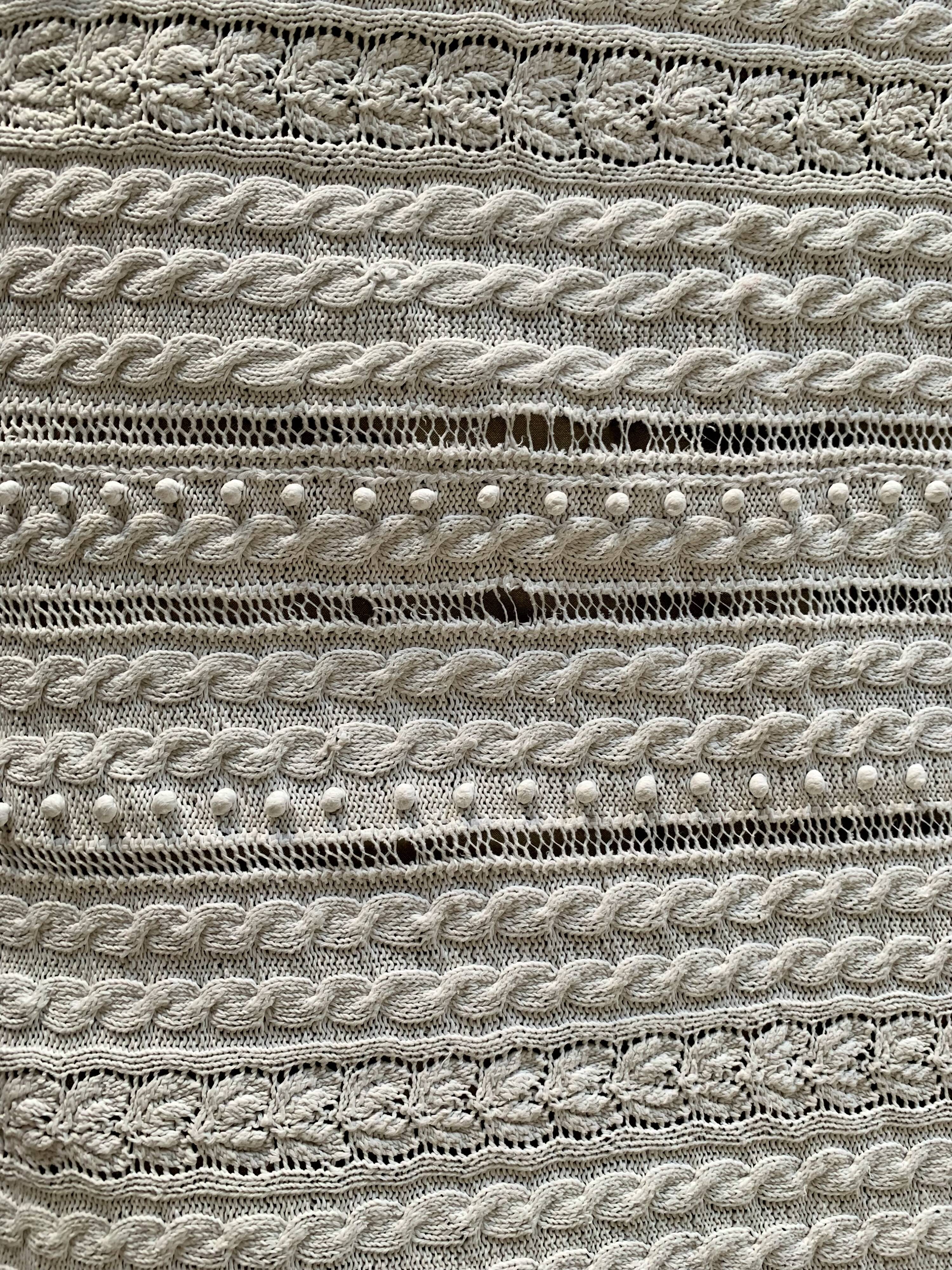 Old knitted cotton bed cover