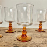 6 small amber-stemmed glasses