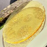 Glass plate decorated with suns, 1980.