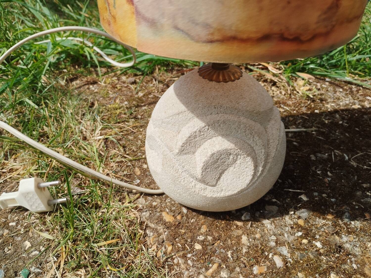 Vintage antique lamp with a stone base.