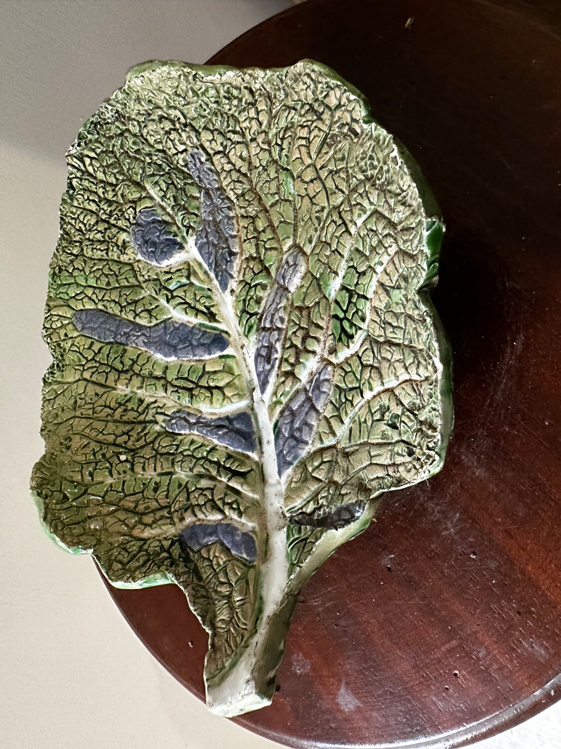 Vintage ceramic leaf-shaped vide poche, signed.