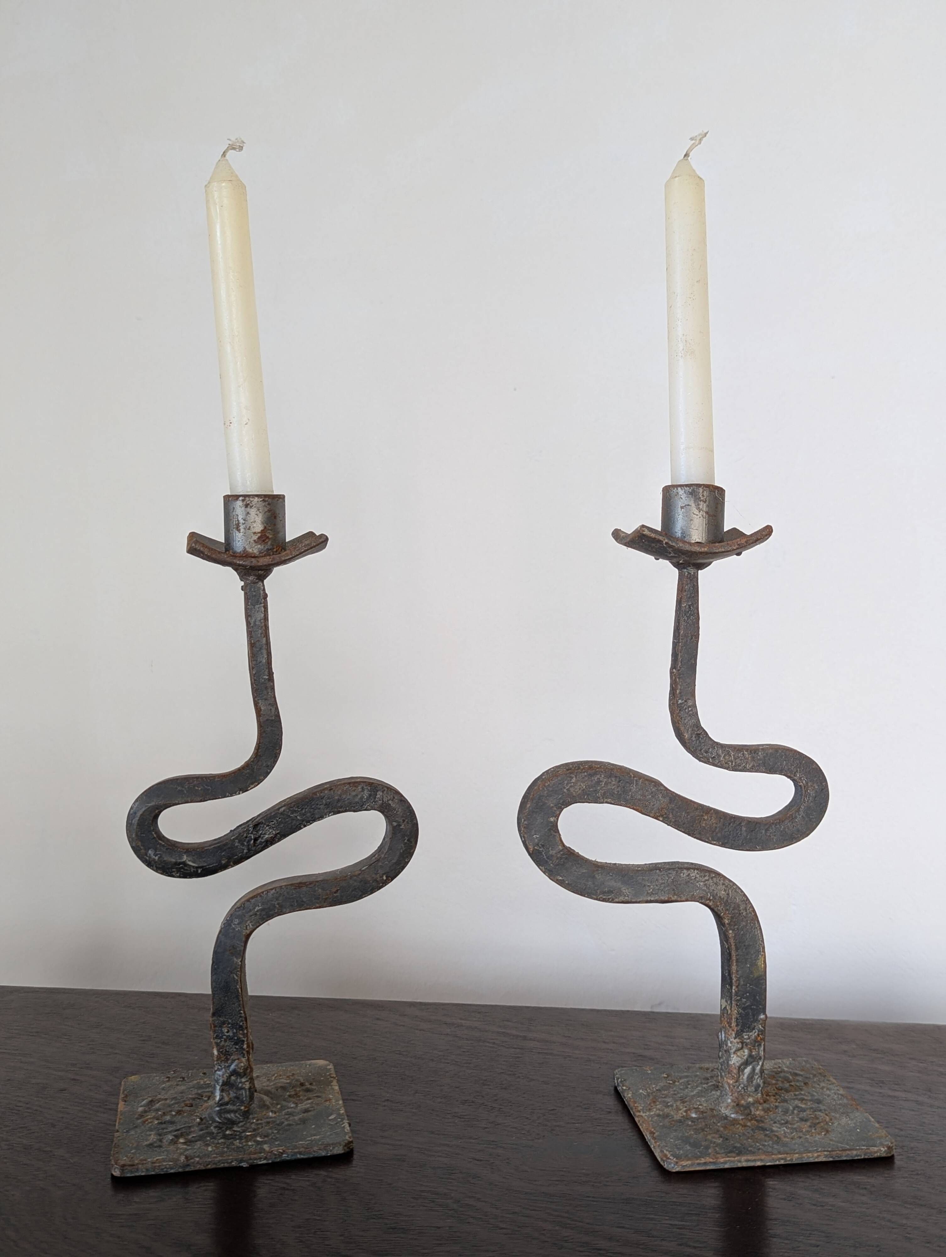 Pair of wrought iron candlesticks