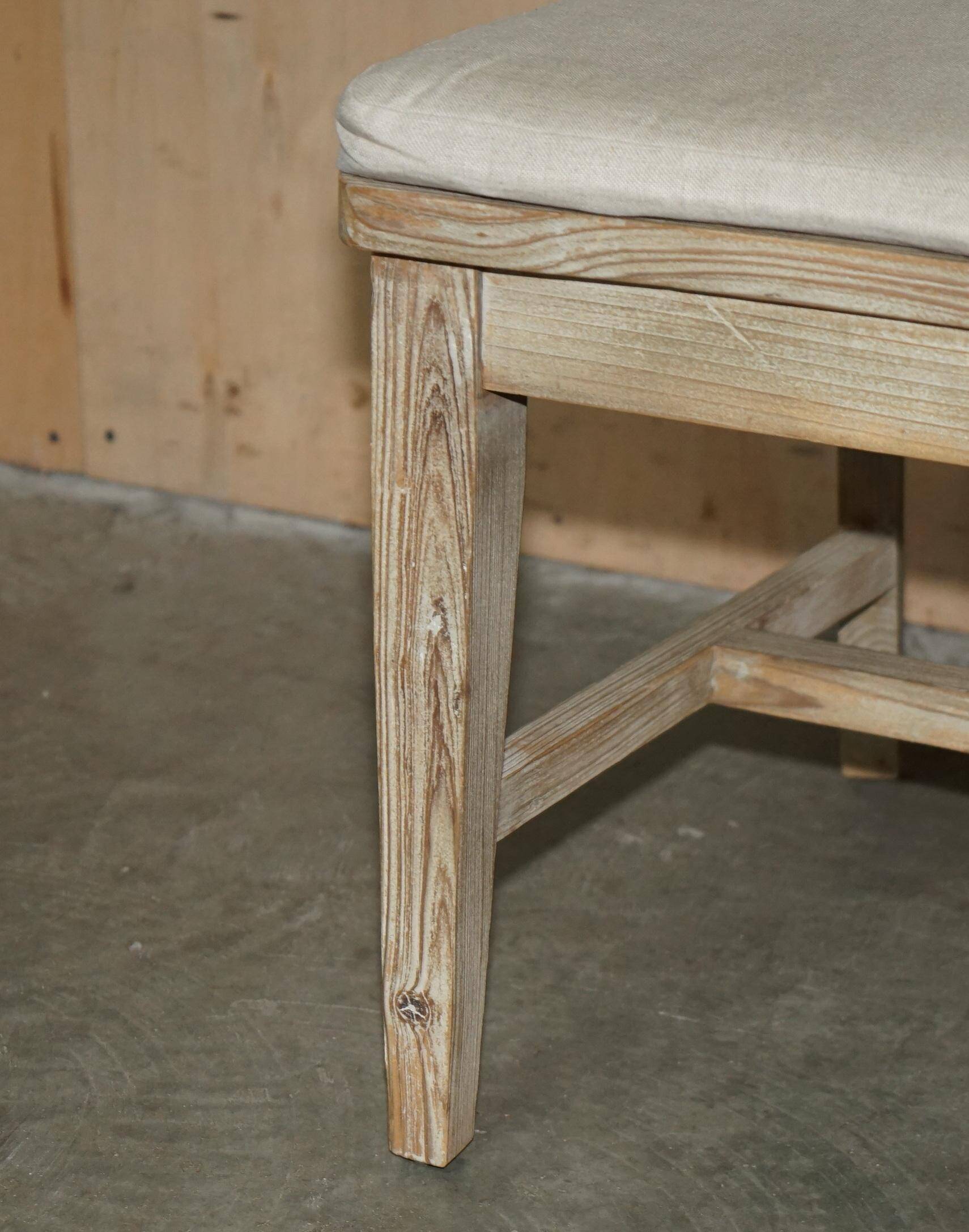 Pair of Swedish-style accent chairs in recycled pine with upholstered seats.