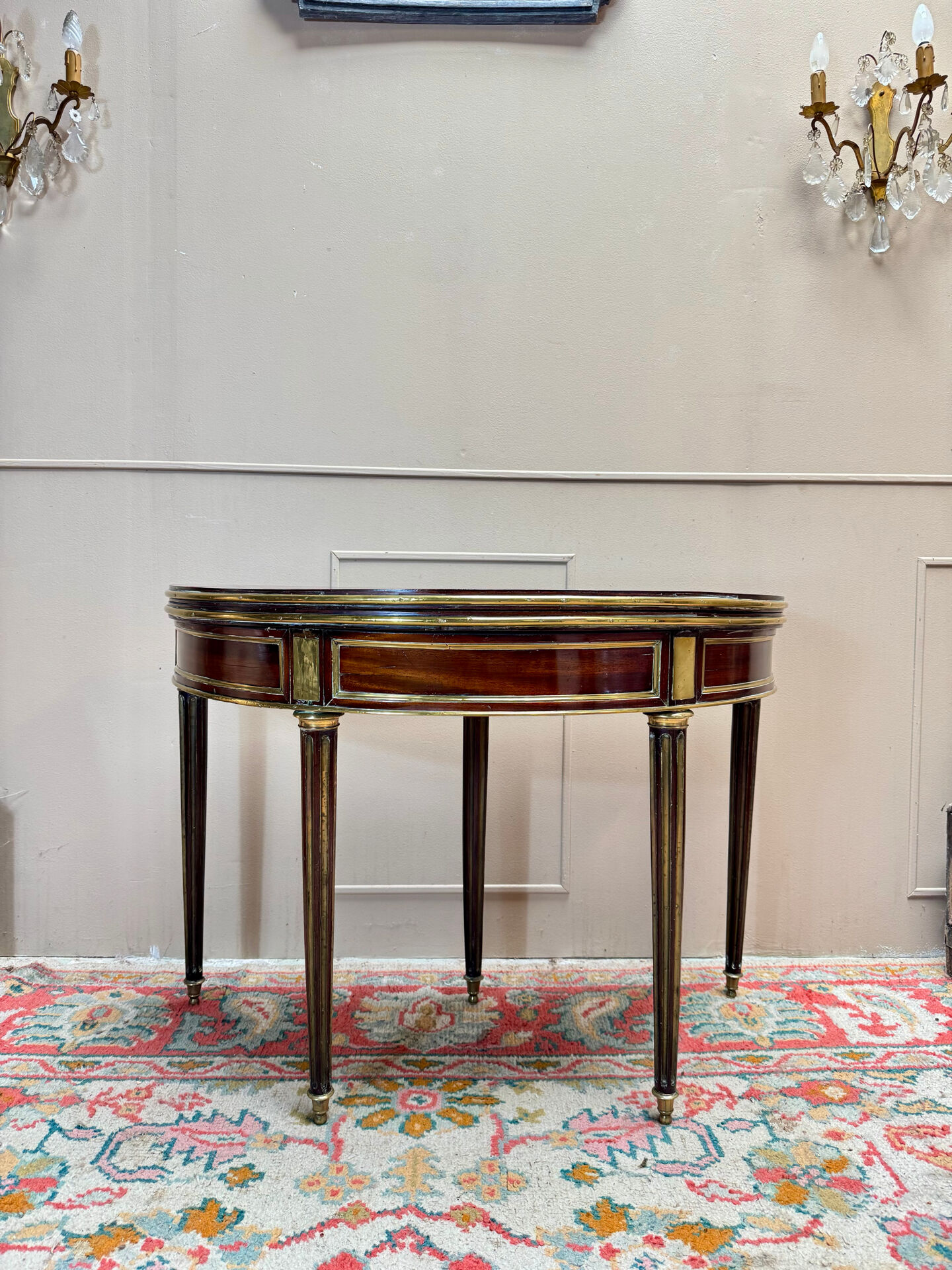 Half-moon table in mahogany from the Louis XVI period, 18th century.