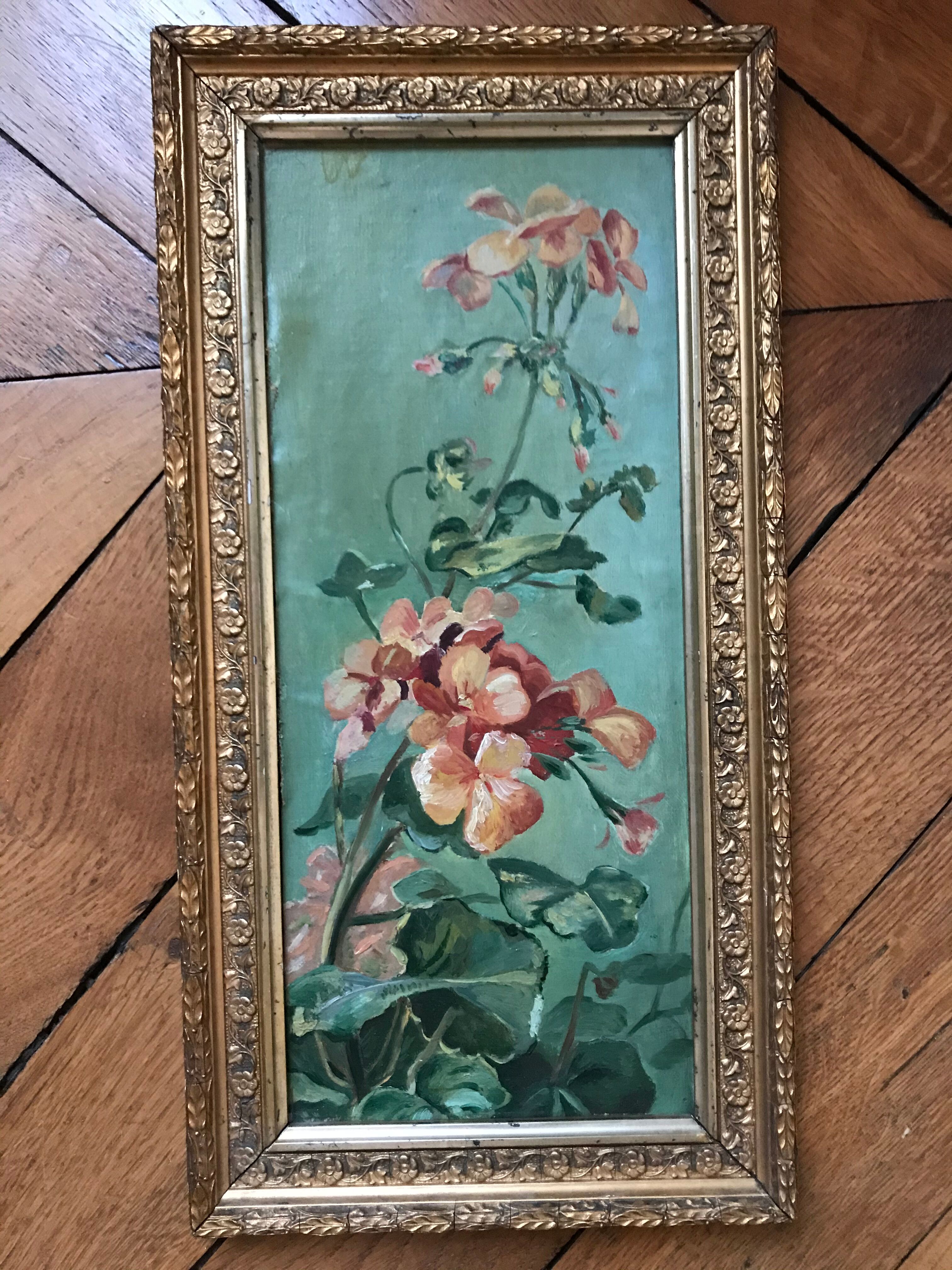 Two old paintings of flowers and gilded frames