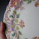 Short antique Longchamp stand with polychrome daisies in earthenware.