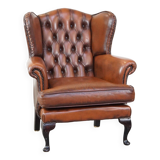 Very beautiful, stately, cowhide Chesterfield wing chair with elegant legs in a nice brown color