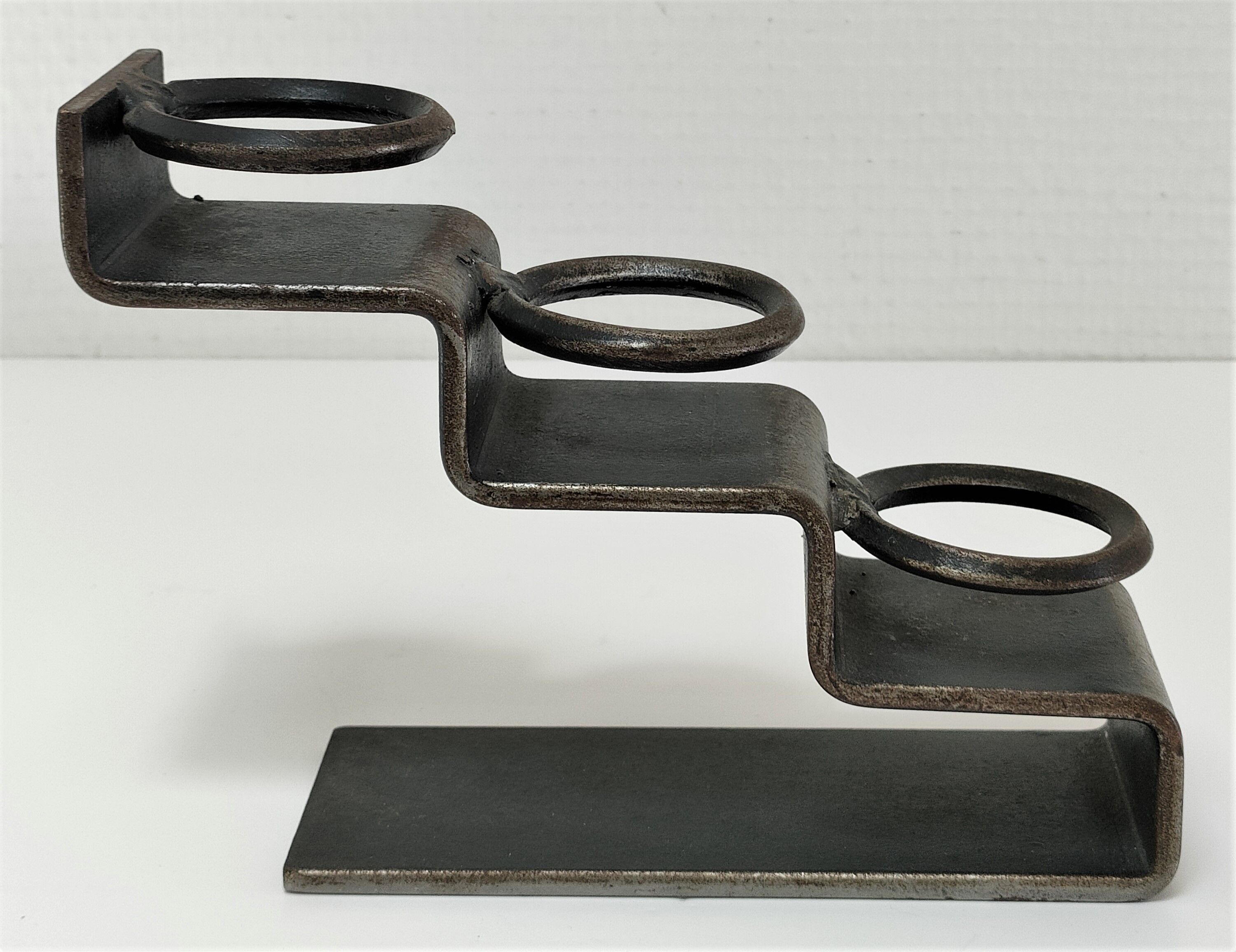 Sculptural candle holder patinated steel design 80s