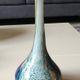 Ball vase soliflore with a long chimney neck. In speckled glass in the Murano style.