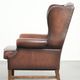 Comfortable cowhide wingback armchair in English style with a timeless look