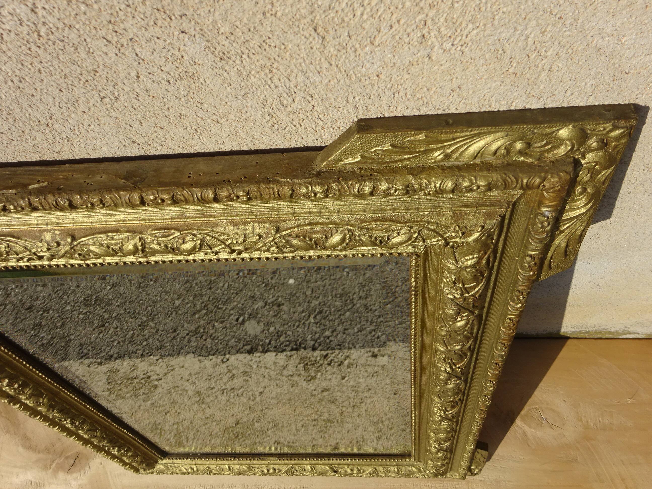 Antique mercury mirror in the Napoleon III style.