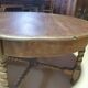Table basse ronde en ormeau avec pieds torsadés - début XXè