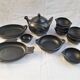 Black terracotta dinnerware set from La Chamba in Colombia. Set of 13 pieces.