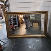 Golden mirror in oak from the 19th century.