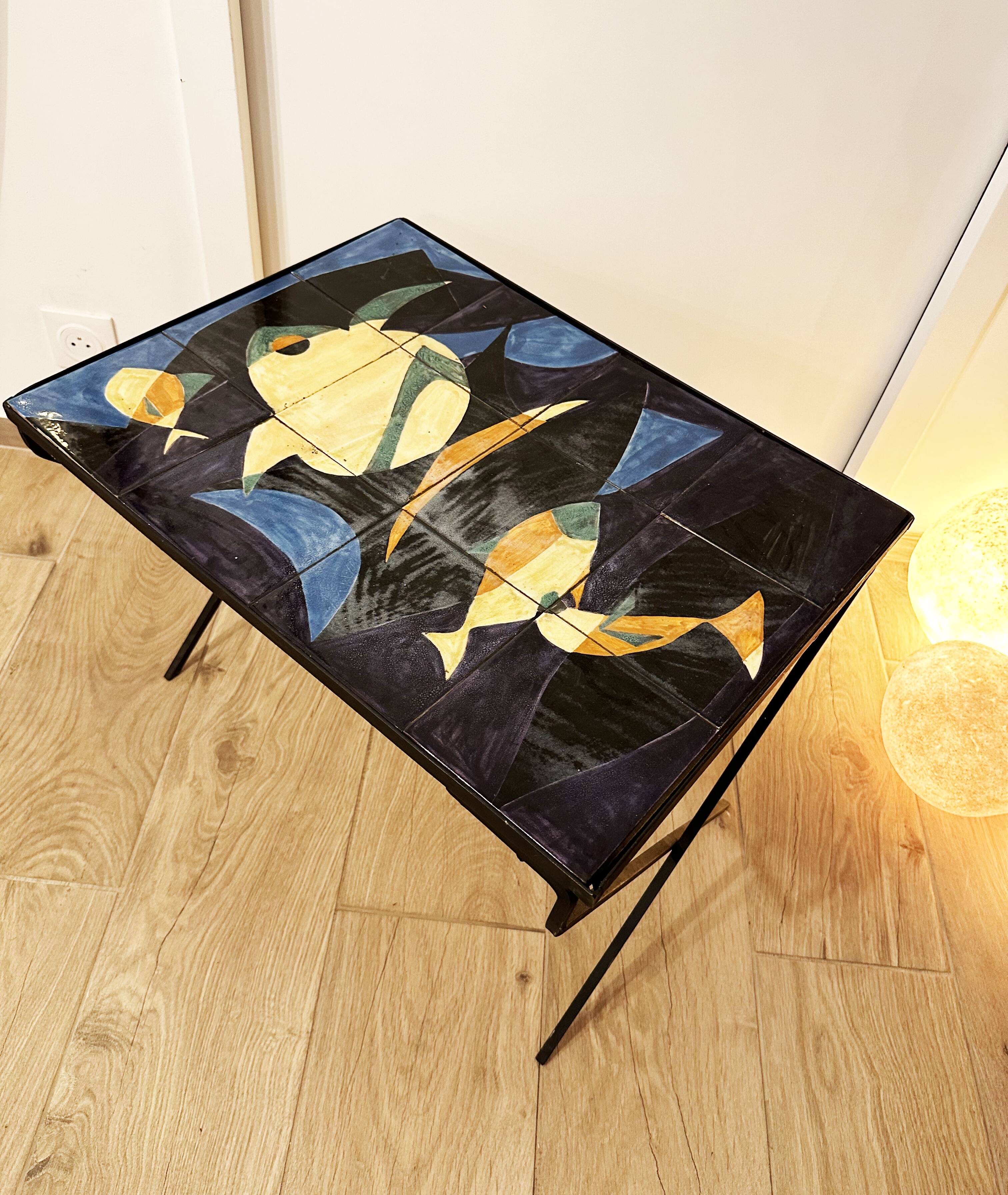 Coffee table with hand-painted ceramic top. France, 1950s