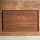 Rectangular solid teak tray with carved edges 40x25