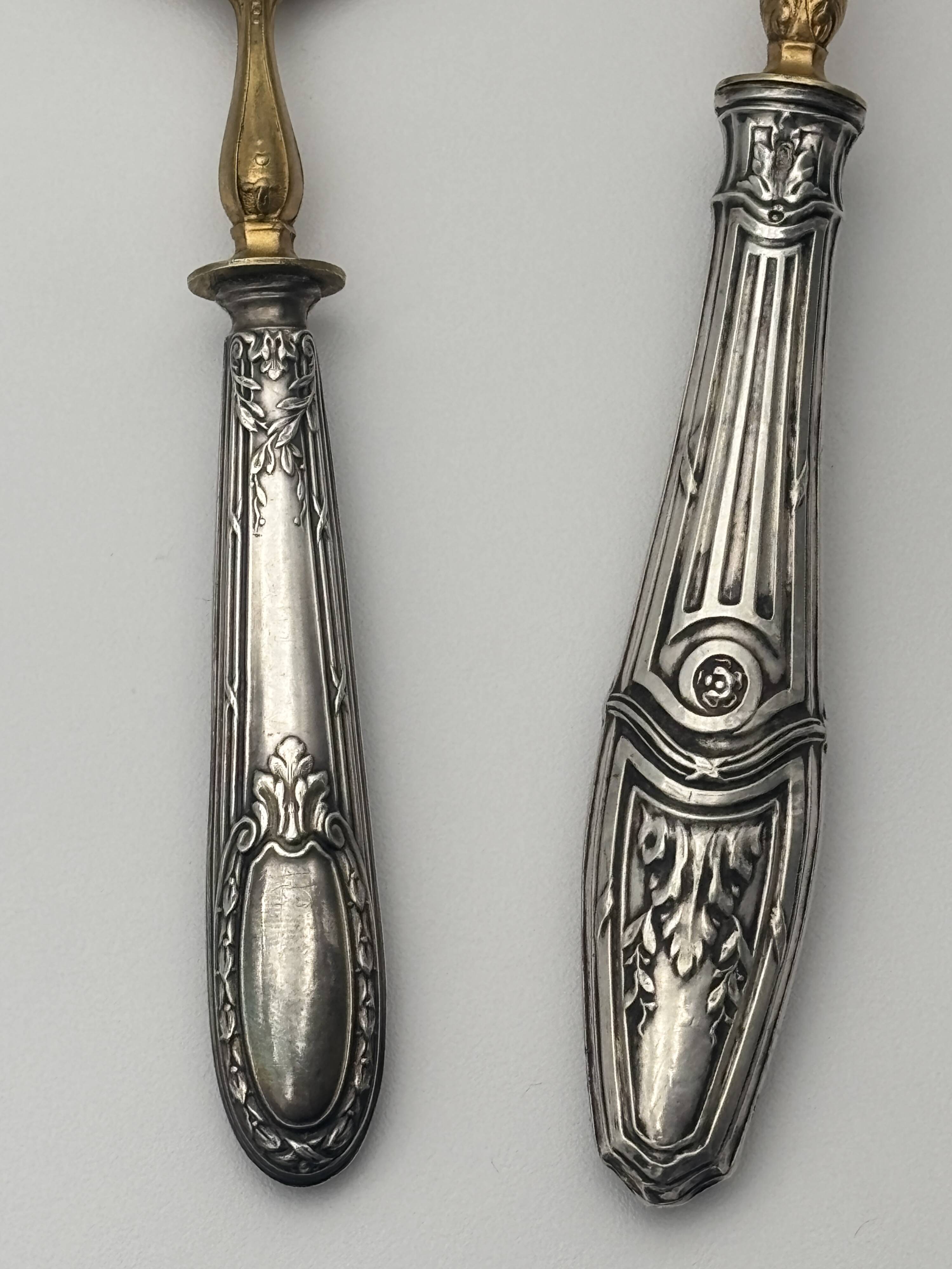 Pair of silver Minerva and vermeil shakers, 19th century.